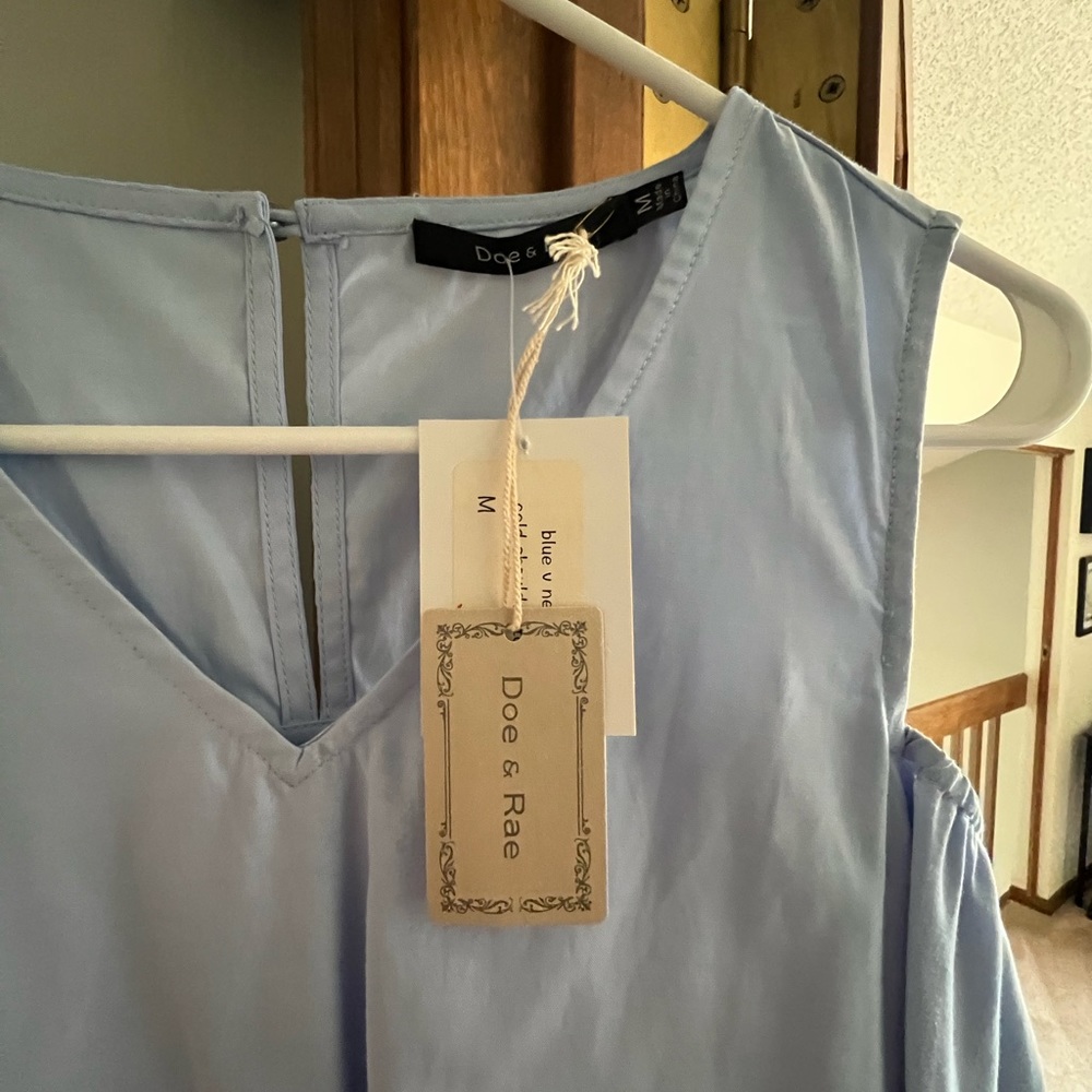 Brand new blouse. From local boutique. Size medium. Bell sleeves